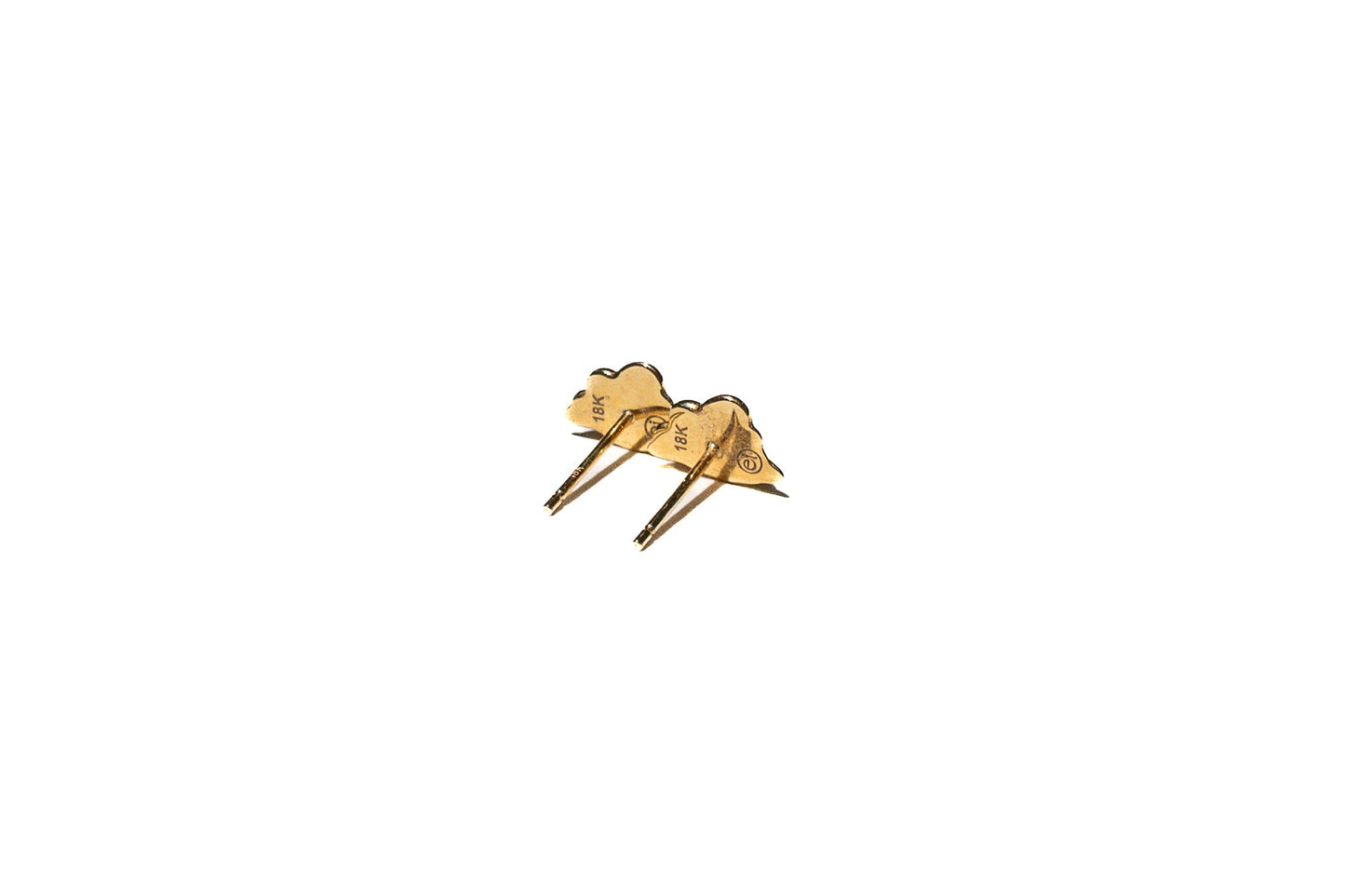 Side angle of gold nebulous studs demonstrating soft, amorphous form