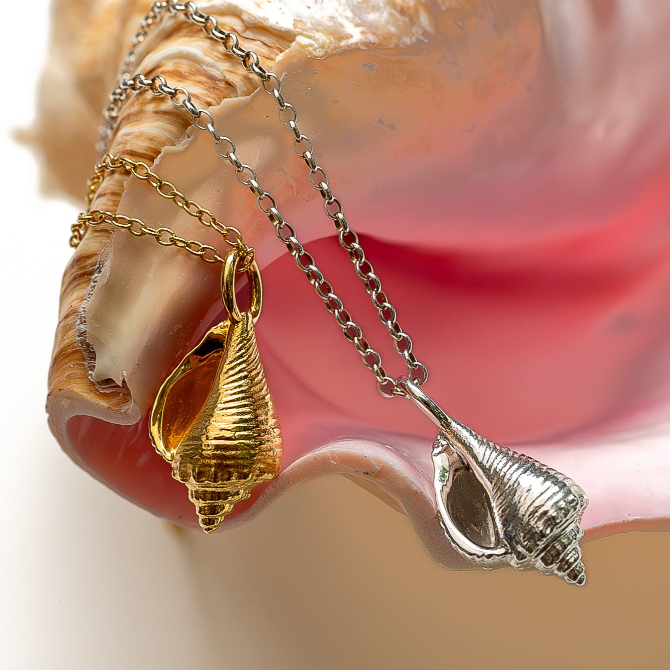 Model wearing luxurious gold conch necklace with beach-inspired styling