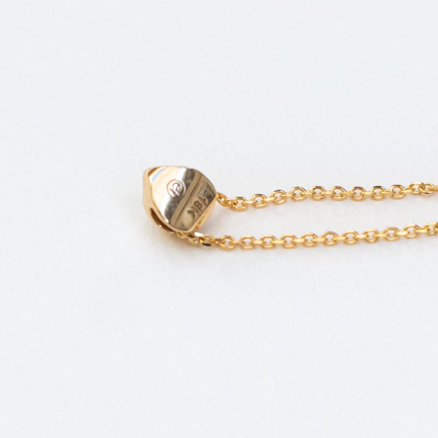 Pendant detail showing opal's changeable nature and sculptural mounting