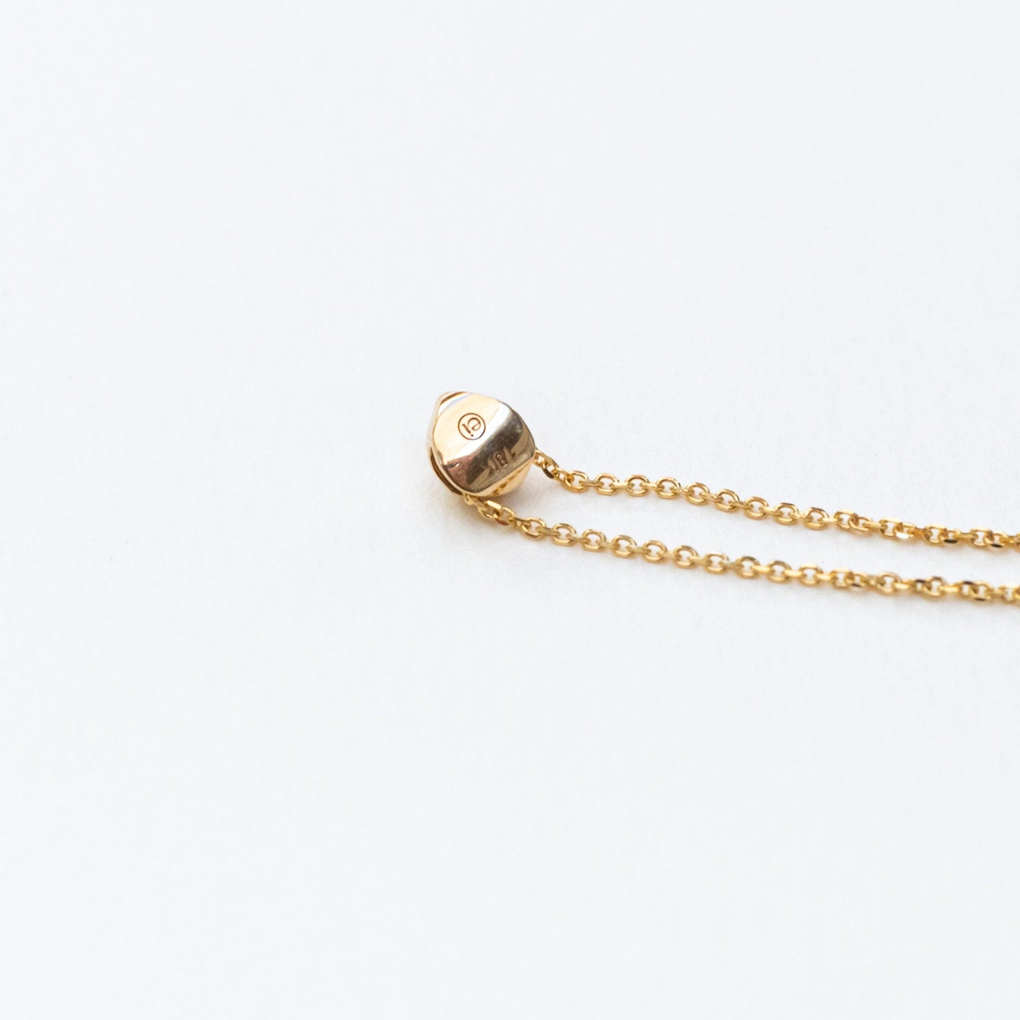 Model wearing oceanus opal slide pendant necklace as layering piece