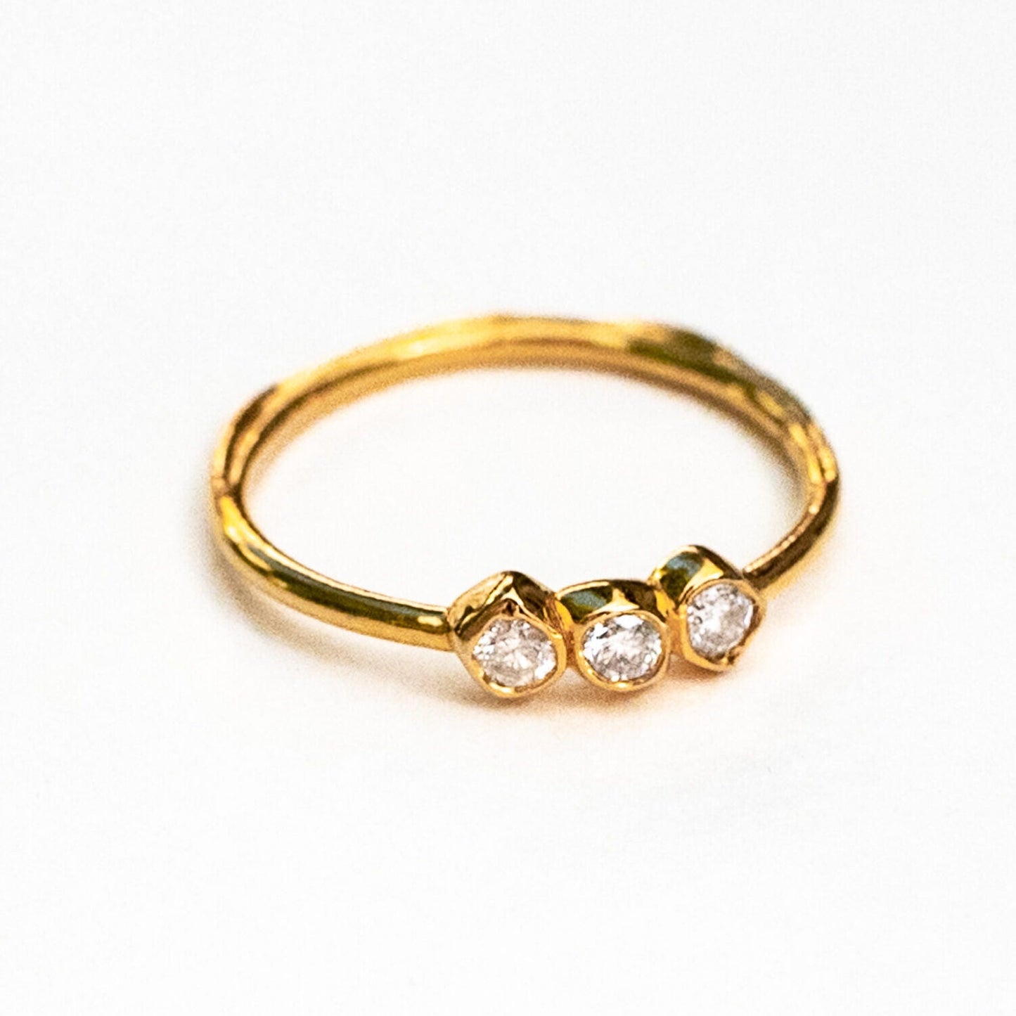 Bottom view of three sea stones ring showing gold band craftsmanship