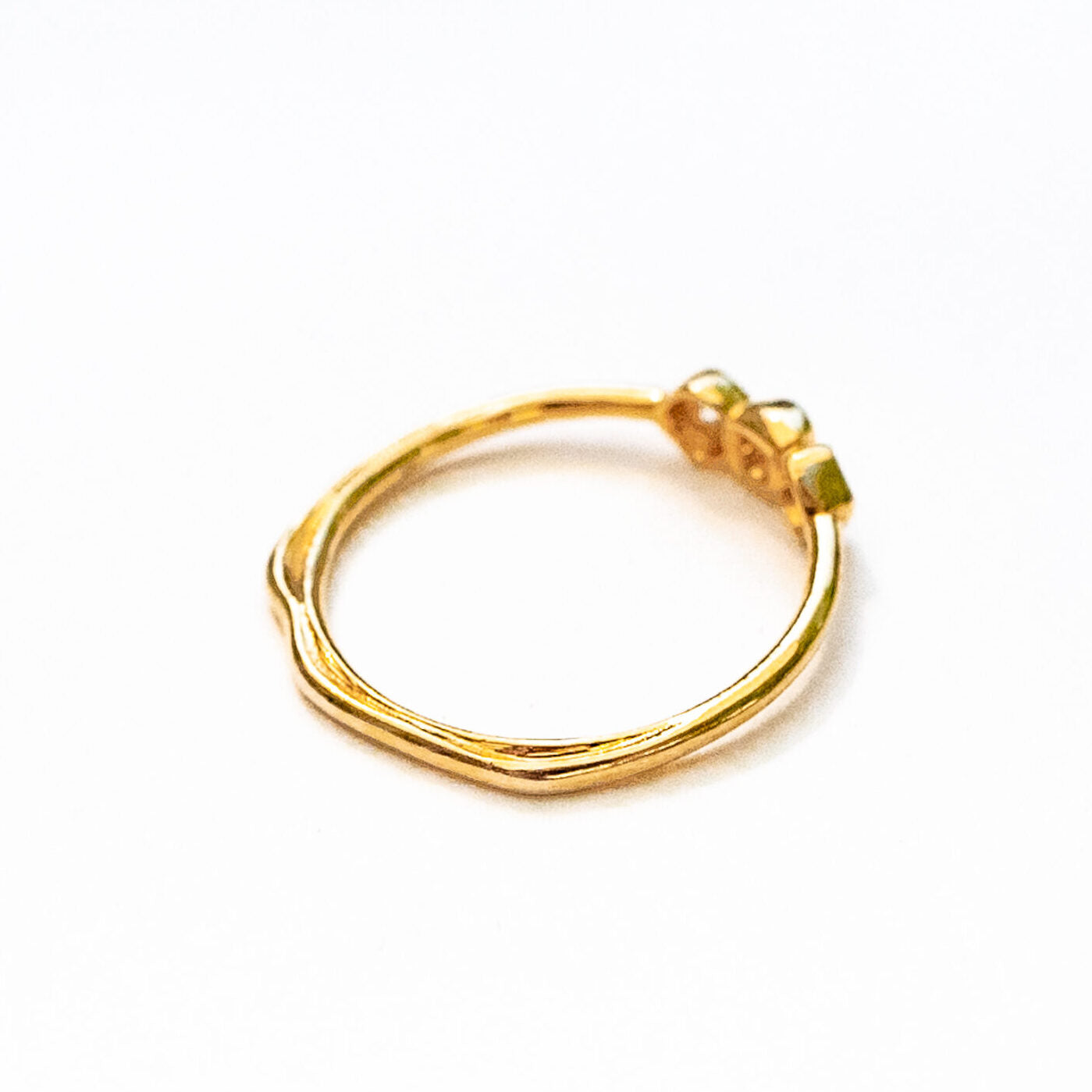 Model hand wearing three sea stones diamond ring, lifestyle jewelry photography