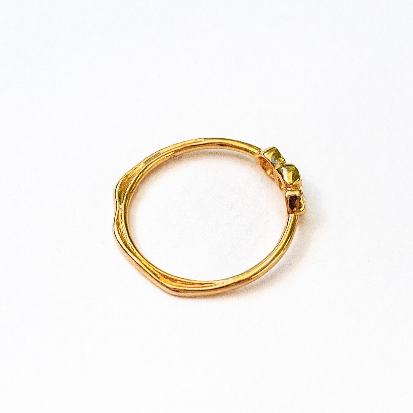 Top view of three sea stones ring demonstrating organic triad diamond arrangement