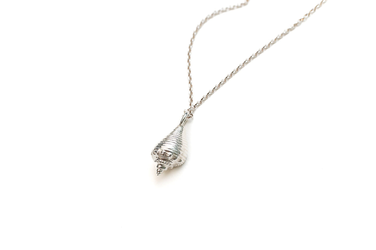 Model wearing ethereal silver conch necklace with ocean-inspired styling