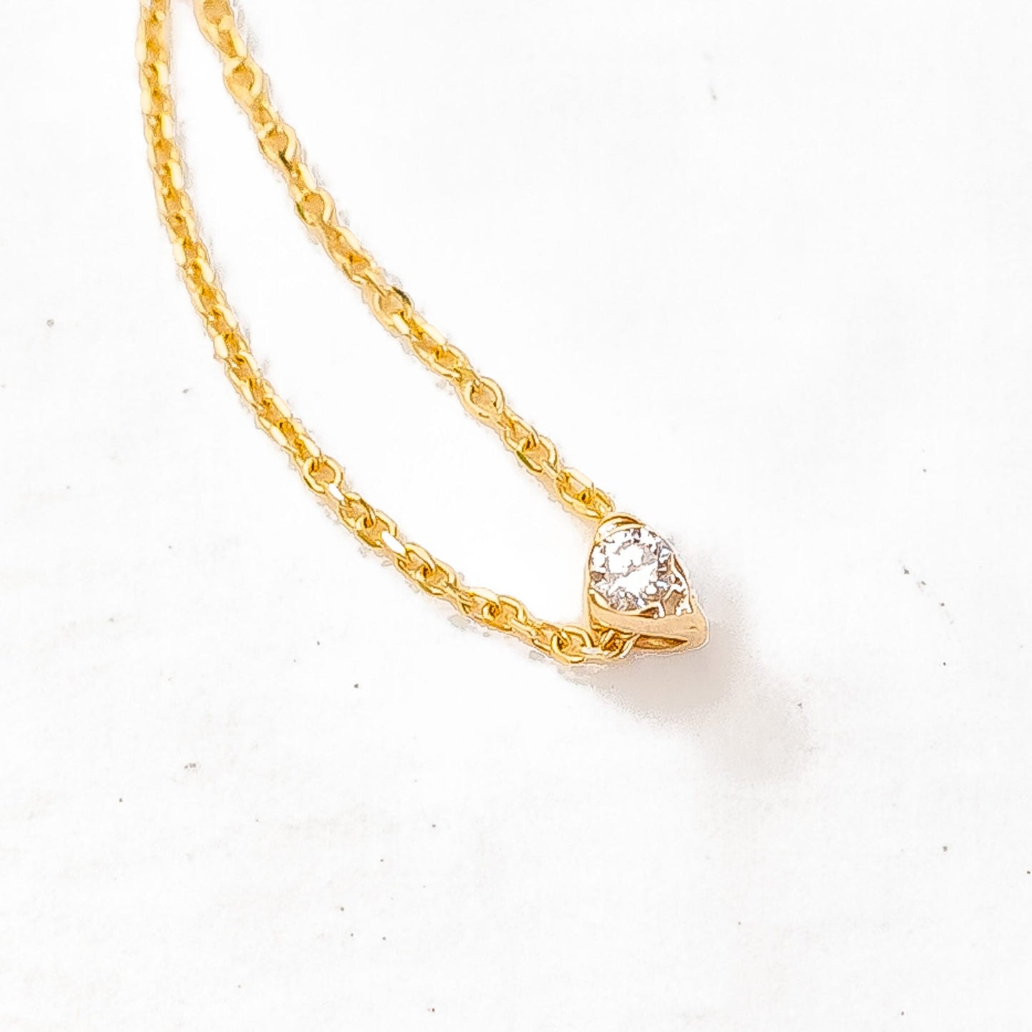Close-up of diamond in sea stone inspired slide setting showing detail
