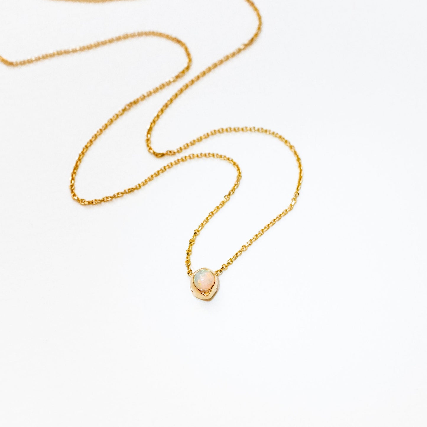Full view of oceanus opal slide necklace showing chain and pendant together