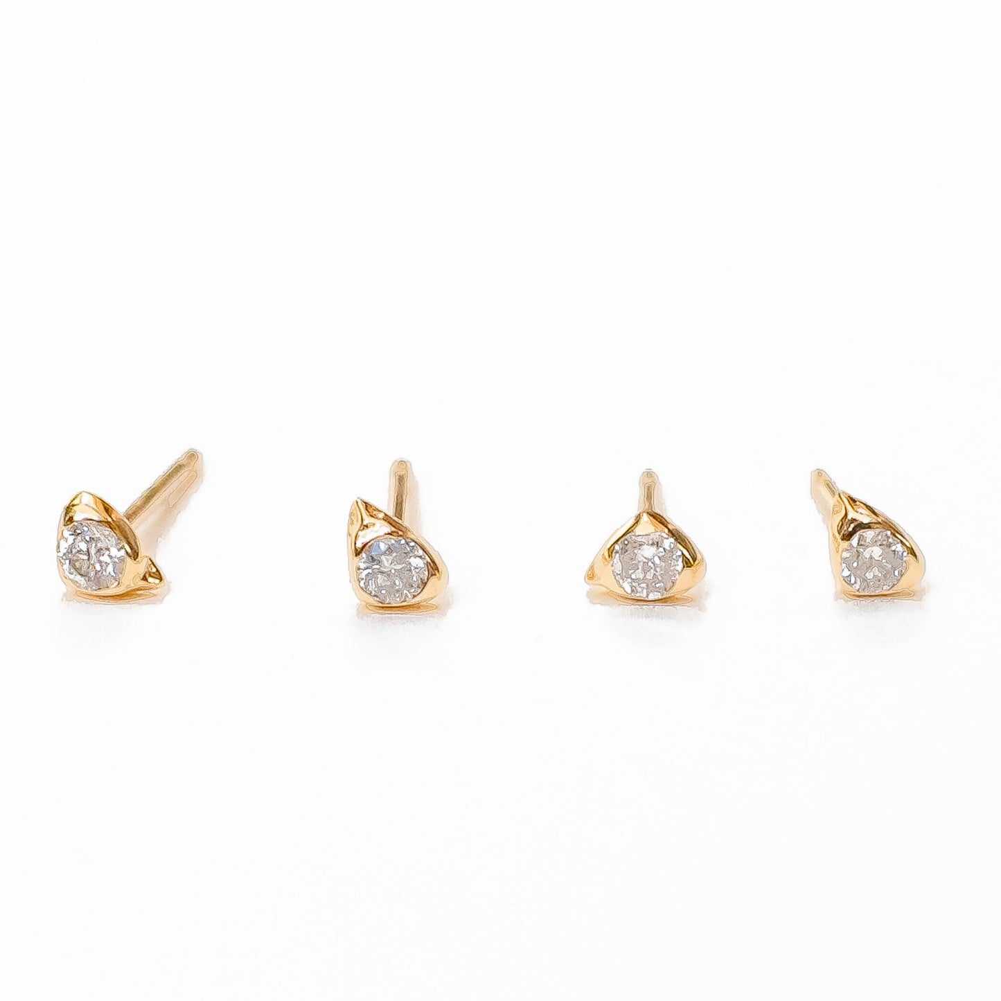 Side angle of sea stone diamond studs demonstrating organic form
