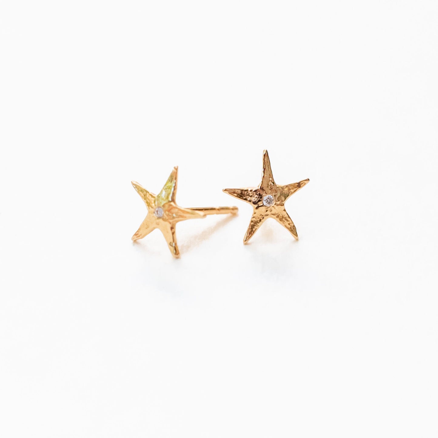 14K gold sea star stud earrings with natural diamond centers, ocean-inspired design
