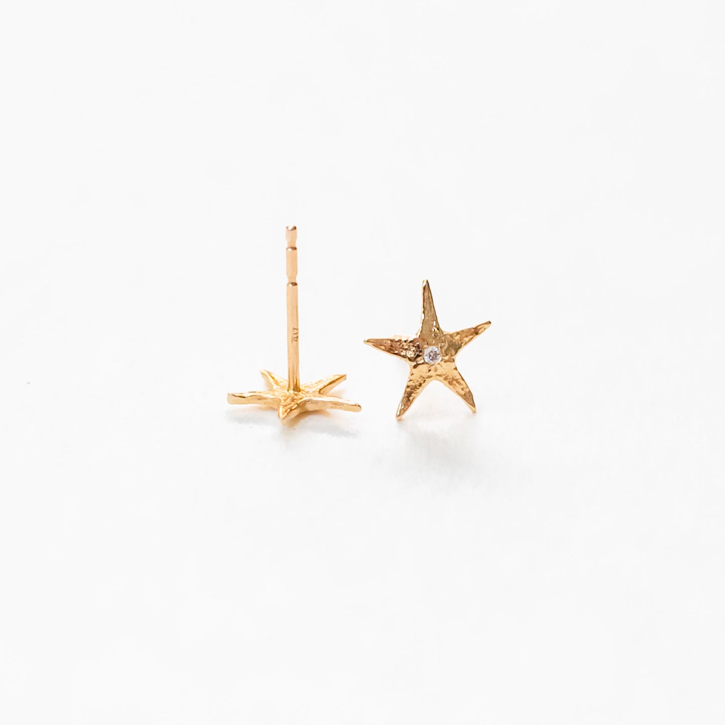 Side profile of sea star stud demonstrating sculptural form and symmetry